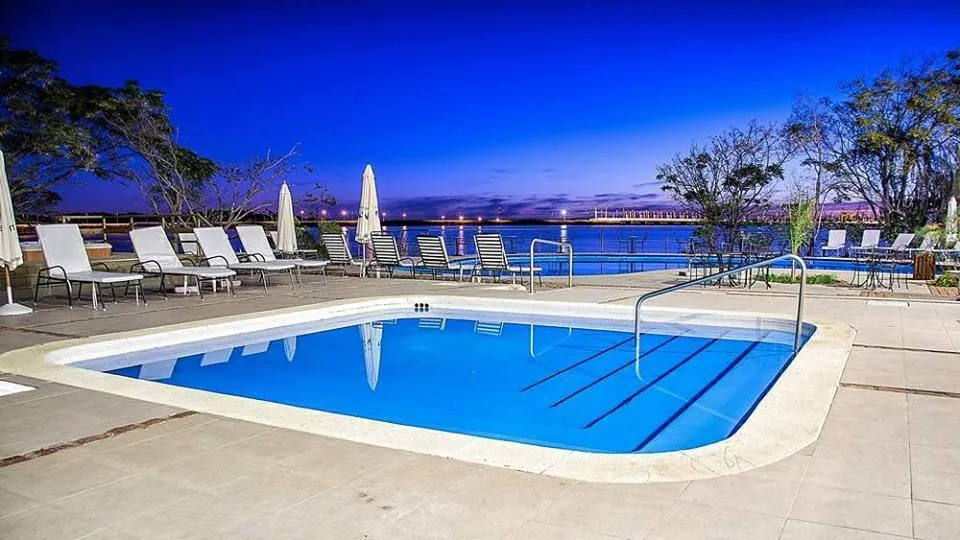 The pool at Hotel Horacio Quiroga at dusk, on Parque del Lago, Salto Grande