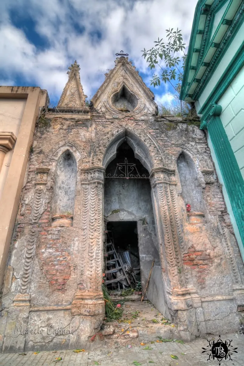 A neo-Gothic mausoleum with its render fallen away to the brick, Central Cemetery of Salto, Uruguay