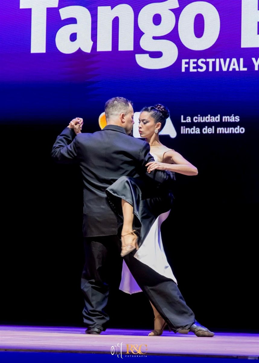Tango in Salto, Uruguay - AnGarTango dancers holding an elegant tango pose during a stage performance