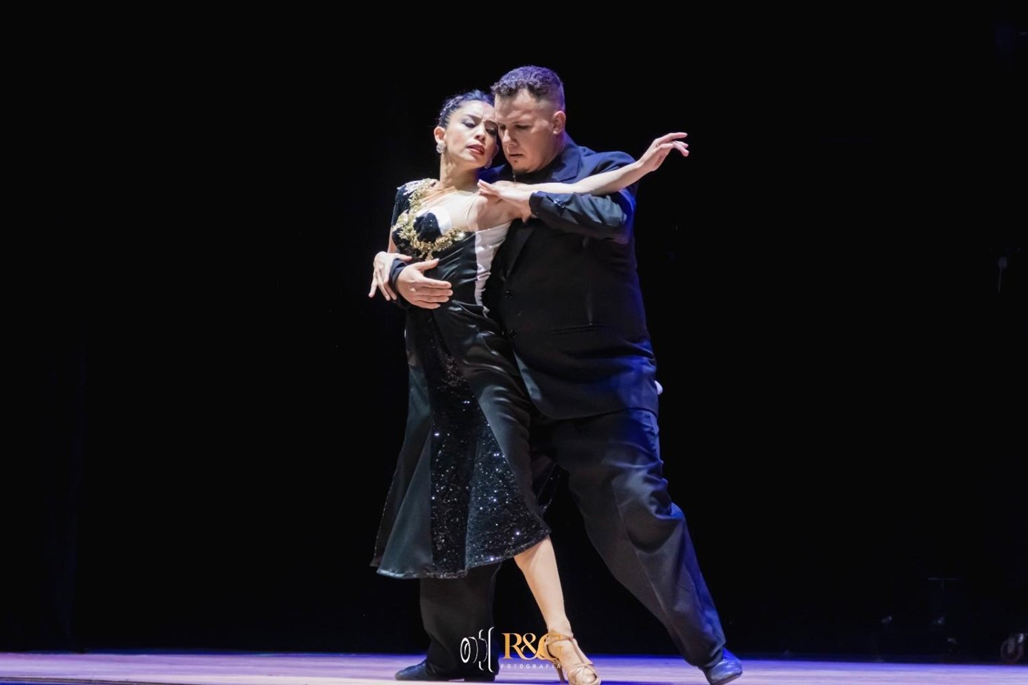Tango dancers performing on stage in Salto, Uruguay