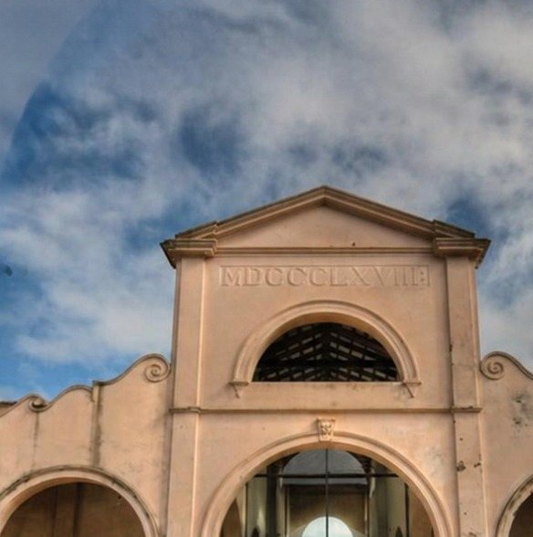 Arched entrance of a historic building in Salto dated MDCCCLXVIII (1868)