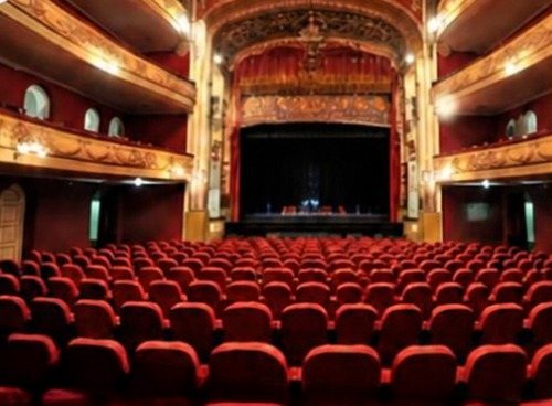 Red seats and gilded boxes inside the Teatro Larranaga, Salto